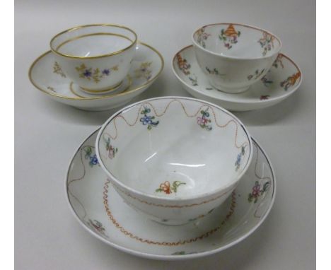 Three similar late 18thC New Hall porcelain tea bowls and saucers, decorated in colours with simple floral designs  pattern n