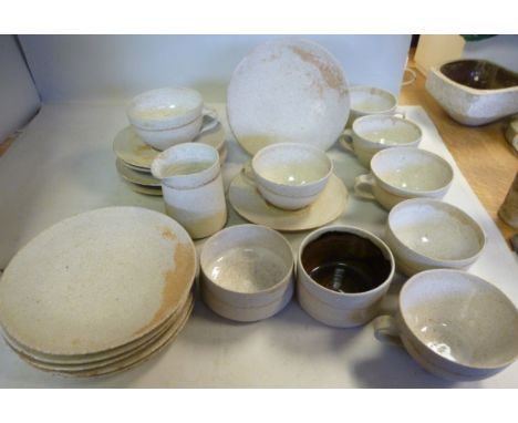 A Ruth Duckworth stone pottery part tea set, viz. six plates, seven cups, six saucers, a milk jug, sugar basin and slop basin