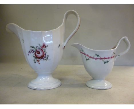 A late 18thC New Hall porcelain helmet shaped cream jug, decorated in colours with simple floral designs  pattern no.122; and