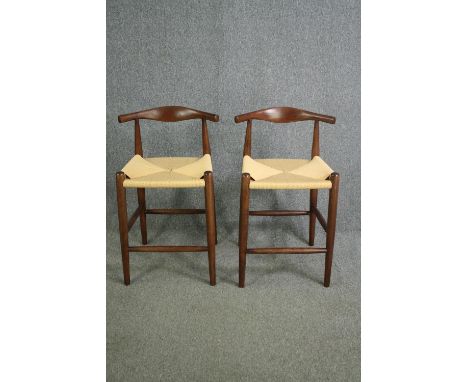 A pair of contemporary vintage Danish style hardwood counter stools. H.81cm. (each). 