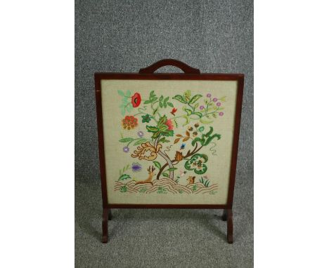 A mid century fire screen with tapestry insert, glazed. H.76 W.55cm. 