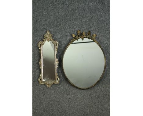 A vintage gilt metal oval wall mirror with vine leaf cresting, and a smaller white painted and parcel gilt mirror. H.61 W.45c