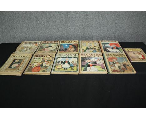 Becassine, a collection of eleven vintage comic books. H.31 W.23cm. (each). 