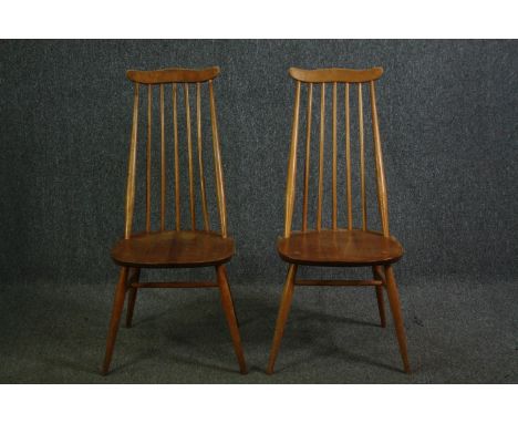 A pair of beech and elm Ercol Goldsmith 369 dining chairs. H.96cm. (each). 