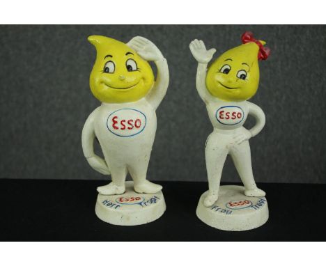 A pair of reproduction cast metal Esso advertising money boxes in the form of Andy and Abbey Slick. H.23cm. (each). 
