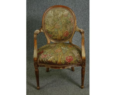 A George III beechwood armchair in the manner of John Linnell, with tapestry upholstery. H.95cm. 