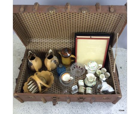 Wooden bound travelling trunk containing a 6 piece tea set and other china