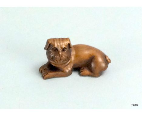 fruitwood carved netsuke in the form of a dog