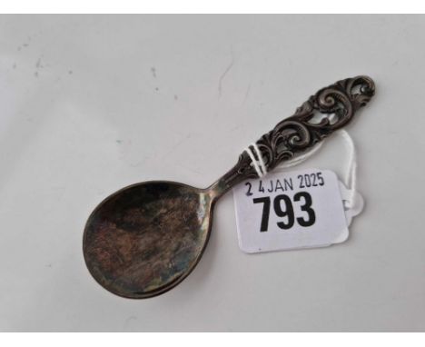 A Continental (830 standard) caddy spoon decorated with scrolls