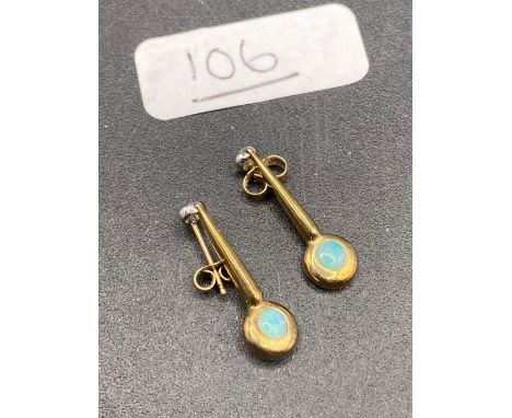A pair of diamond and opal earrings 9ct 22 mm drop 2 gms