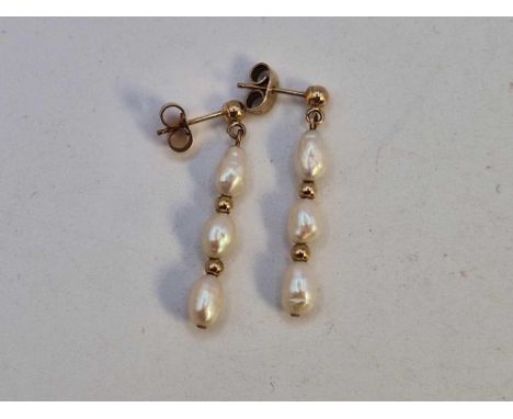 A pair of gold three pearl drop earrings, 9ct