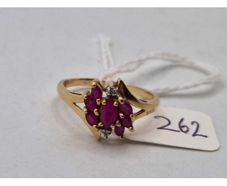 A nine stone ruby and diamond ring, size R, 2.5 g.