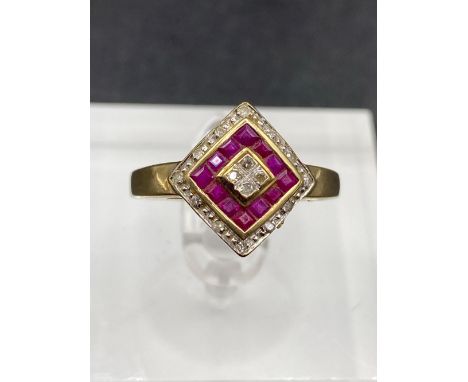 A ruby and diamond art deco shaped ring with mystery setting for the calibrated ruby's size P 2.1 gms