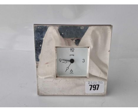 A silver cased clock signed Carrs, England, 4.5" high