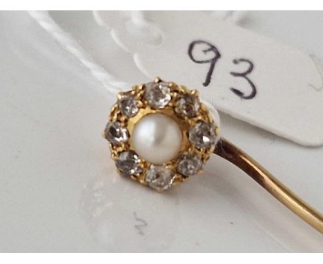 A gold pearl and diamond topped stick pin, 2.9 g.