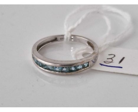 A blue topaz half eternity ring 9ct size M 1.7 gms