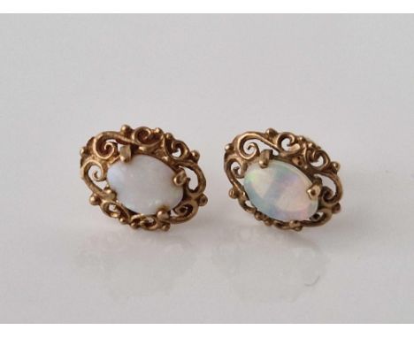 A pair of opal ear studs, 9ct, 1.2 g.