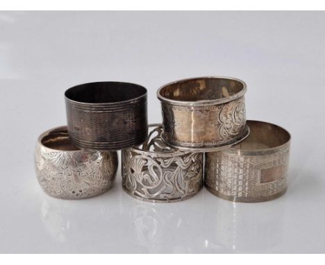 An Art Nouveau pierced napkin ring and four others, Birmingham 1907, 110 g.