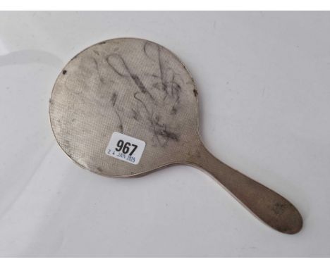 A hand mirror with engine turned decoration
