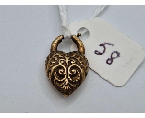A Victorian yellow metal heart with bolt ring clasp