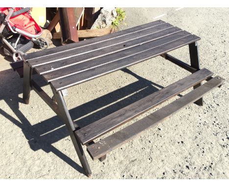 A stained picnic bench