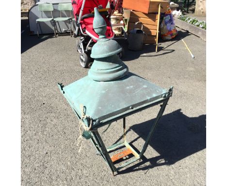 A copper street lamp hood.