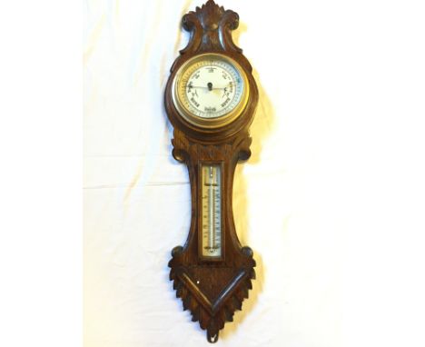 A wall mounted barometer.