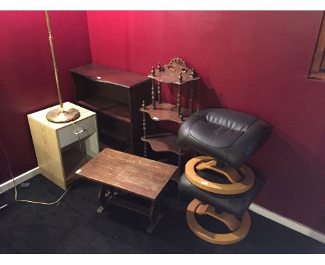 *A pair of foot stools a standard lamp a bookcase and others.