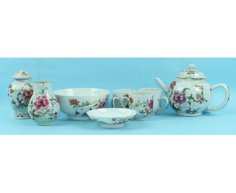 An 18th century Chinese famille rose part tea service decorated with flowering shrubs, comprising teapot and cover, teapoy an