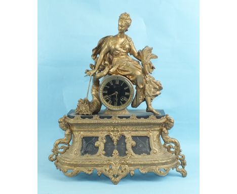 A spelter and marble mantel clock with Paris-made circular drum movement striking on a bell, surmounted by a figure of Autumn