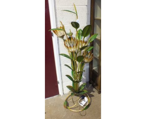 A modern painted metal four-light floor-standing uplighter in the form of a flowering lily plant, 140cm high.