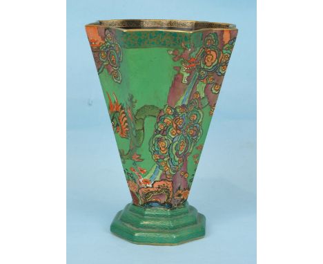 A Crown Devon vase of tapering octagonal form decorated with a dragon, pagoda and flowers, on a green ground and stepped base