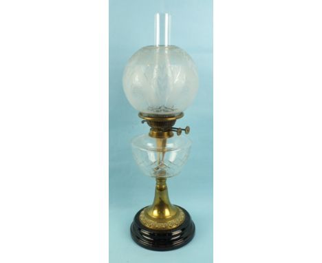 A Victorian brass oil lamp with etched glass bowl shade and cut glass reservoir, 60cm high.