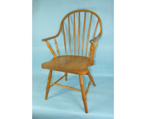 A set of four Jeromy Rowett ash stick-back Windsor chairs, with solid seats on 'bamboo' carved legs, stamped 'Rowett', (4).