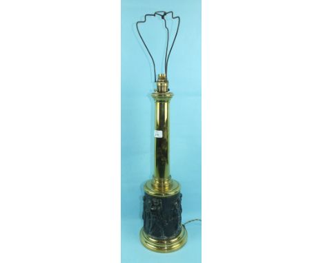 A brass and metal oil lamp stand, the plain column on a wider cylinder base embossed with classical figures, 56cm high, conve