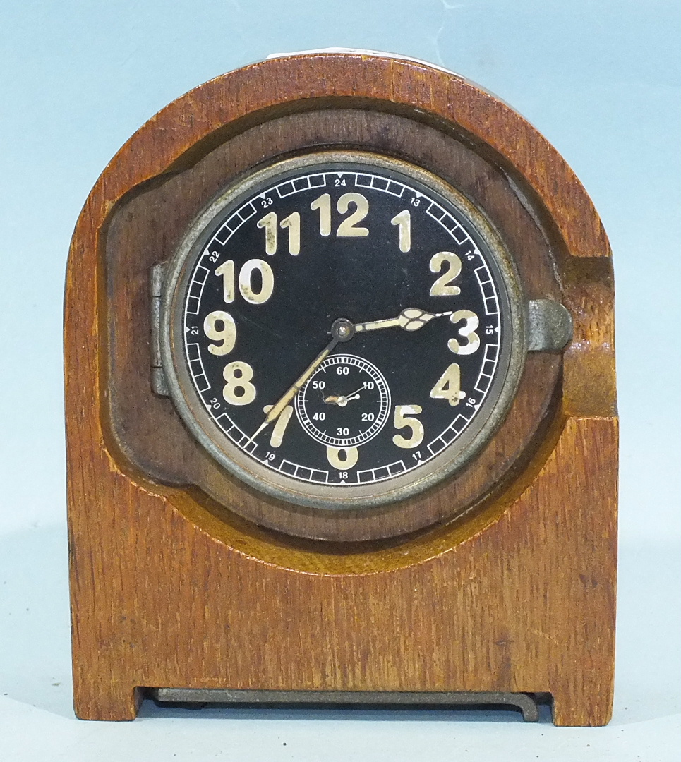 A WWII German Heereseigentum duty clock with black 6.5cm circular