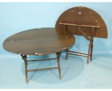 Two stained wood folding hunting tables, each circular top on turned X-frame, labelled 'Thornton &amp; Hearne', 112cm diamete