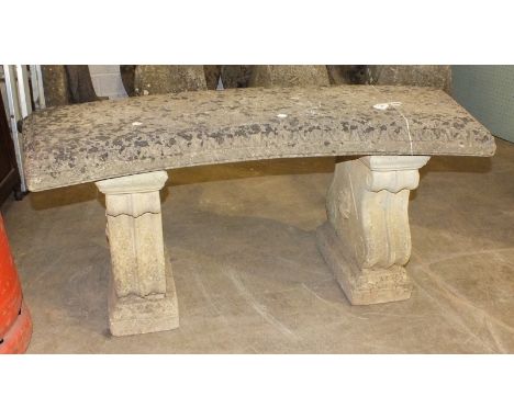 A cast concrete curved garden bench on scrolling supports, 114cm.