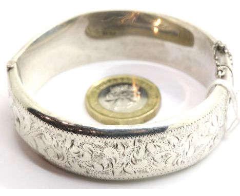 Hallmarked silver snap bangle with engraved decoration. P&amp;P Group 1 (£14+VAT for the first lot and £1+VAT for subsequent 