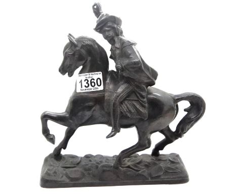 Hollow cast metal cavalier on horseback, H: 25 cm. P&amp;P Group 2 (£18+VAT for the first lot and £3+VAT for subsequent lots)