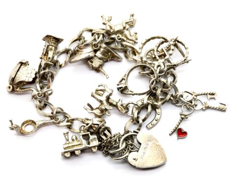 Silver charm bracelet with twelve charms, 27g. P&amp;P Group 1 (£14+VAT for the first lot and £1+VAT for subsequent lots) 