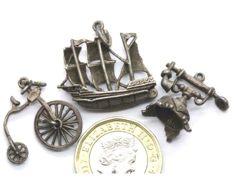 Three vintage silver assorted charms. P&amp;P Group 1 (£14+VAT for the first lot and £1+VAT for subsequent lots) 