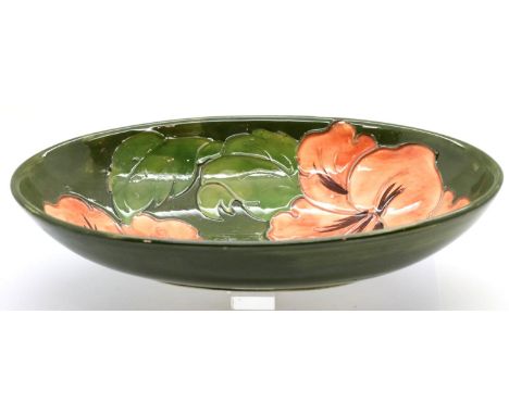 Large oval Moorcroft Coral Hibiscus bowl, L: 23 cm. P&amp;P Group 2 (£18+VAT for the first lot and £3+VAT for subsequent lots