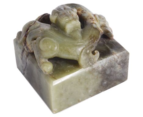 A CHINESE GREEN JADE 'CHILONG' SEAL the straight-sided rectangular seal surmounted by a high relief coiled chilong, face carv