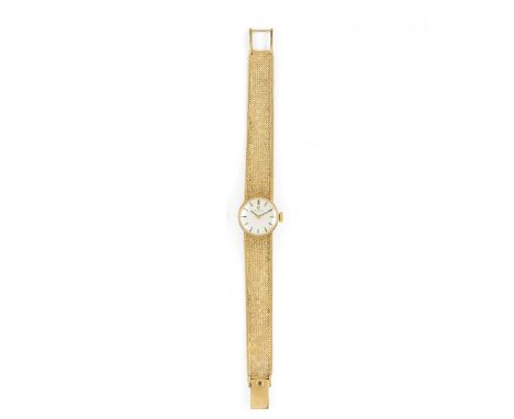 OMEGA: A LADY'S GOLD BRACELET WATCH, 1973 manual wind 17 jewel movement, circular silvered dial with gold baton indicators an