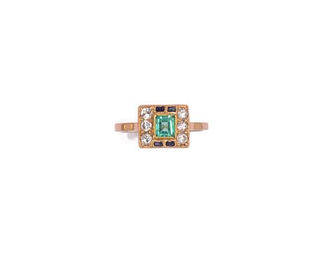 EMERALD, SAPPHIRE AND DIAMOND RING the central step-cut emerald within a surround of French-cut sapphires and brilliant-cut d