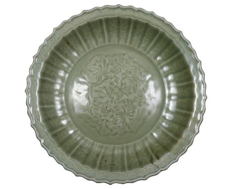 A CHINESE 'LONGQUAN' CELADON LARGE DISH, MING DYNASTY, 15TH CENTURY centrally incised with a foliate medallion within fluted 