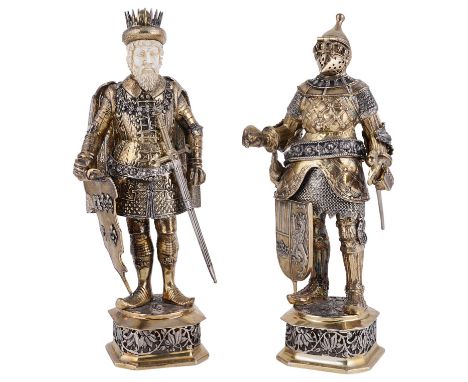 ˜A PAIR OF GERMAN PARCEL-GILT-SILVER FIGURES OF MONARCHS, L. NERESHEIMER &amp; CO., HANAU, EARLY 20TH CENTURY modelled after 