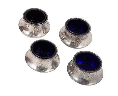 A SET OF FOUR GEORGE V SILVER SALT CELLARS, LEVI &amp; SALAMAN, BIRMINGHAM, 1925 capstan shaped with pendent trefoil motifs, 