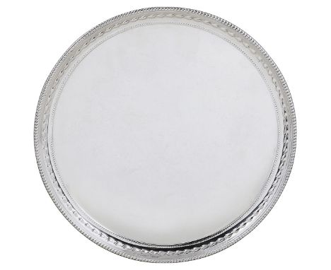 A SILVER SALVER, GARRARD &amp; CO. LTD., SHEFFIELD, 1992 circular, plain excepting a rim of husks within beaded borders, on t